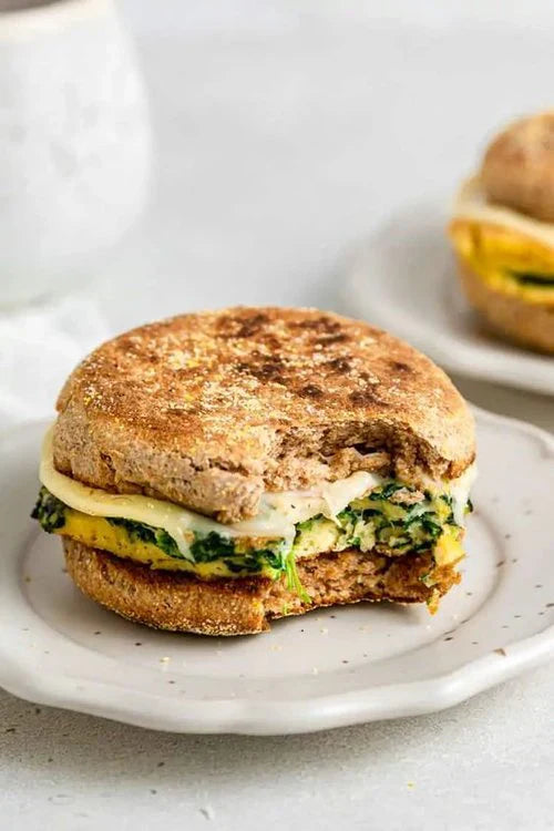 Breakfast sandwich sitting on a plate 